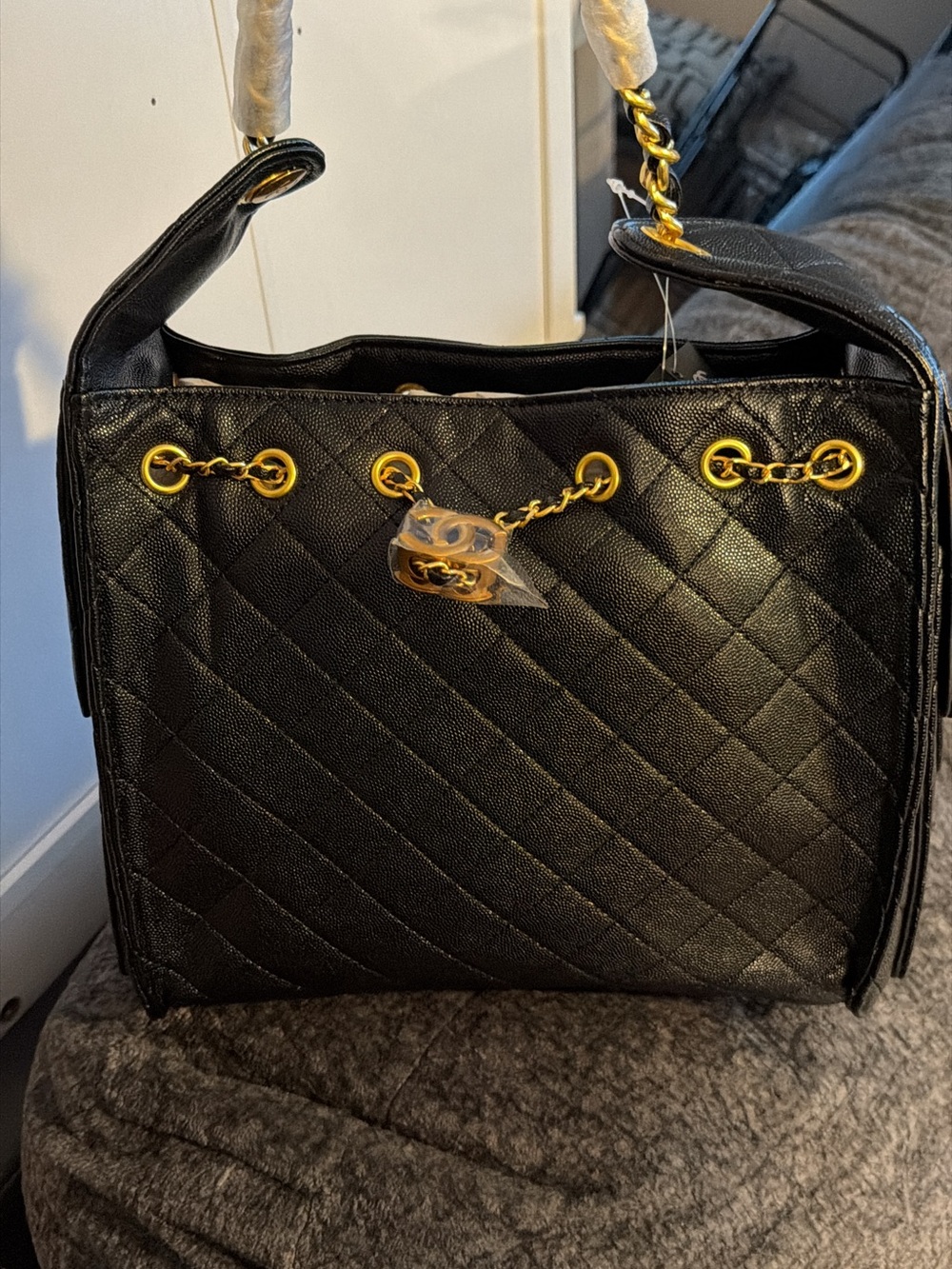 Black Quilted Shoulder Bag with Gold Chain Accents